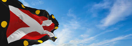 flag of Hampton Poyle village at cloudy sky background on sunset. panoramic view. united kingdom of great Britain, England. copy space for wide banner. 3d illustrationの写真素材