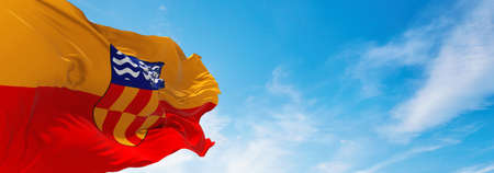 flag of Langford, British Columbia , Canada at cloudy sky background on sunset, panoramic view. Canadian travel and patriot concept. copy space for wide banner. 3d illustrationの写真素材