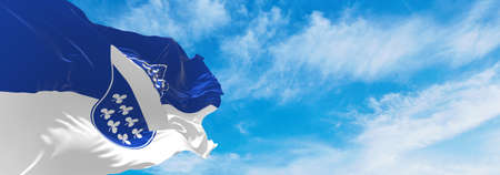 flag of Kassel at cloudy sky background on sunset, panoramic view. Federal Republic of Germany. copy space for wide banner. 3d illustrationの写真素材