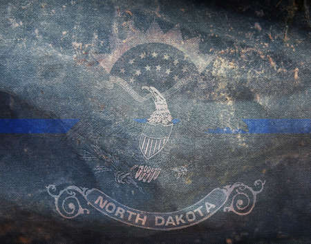 Top view of blue line flag of North Dakota state, Usa. United states of America police flag. retro flag with grunge texture. no flagpole. Plane layout, design. Flag backgroundの写真素材