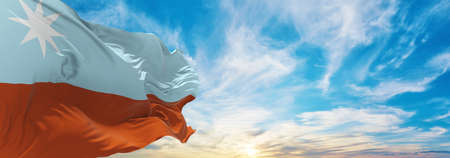 flag of Murrawarri Republic , Australia at cloudy sky background on sunset, panoramic view. Australian travel and patriot concept. copy space for wide banner. 3d illustrationの写真素材