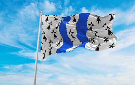 flag of department of Ille et Vilaine, France at cloudy sky background on sunset, panoramic view. French travel and patriot concept. copy space for wide banner. 3d illustrationの写真素材
