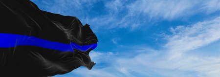 Thin Blue Line flag waving at cloudy sky background on sunset, panoramic view. copy space for wide banner. Flag of Police Officers, Sheriffs. 3d illustrationの写真素材