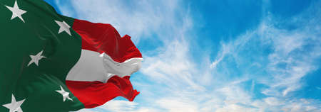 flag of Republic of Yucatan , Mexico at cloudy sky background on sunset, panoramic view. Mexican travel and patriot concept. copy space for wide banner. 3d illustrationの写真素材