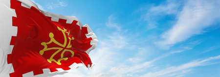 flag of department of Aude, France at cloudy sky background on sunset, panoramic view. French travel and patriot concept. copy space for wide banner. 3d illustrationの写真素材