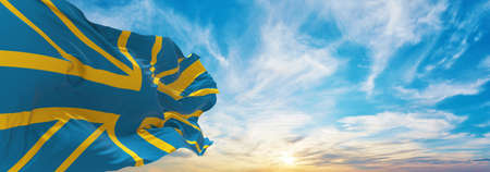 flags of United Kingdom in colors of Ukrainian flag waving in sky. panoramic view. Concept of Solidarity with Ukraine. Ukrainian lives matter. I Stand With Ukraine. Stop war. 3d illustrationの写真素材