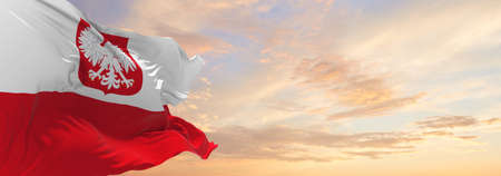 flag of Naval Ensign  , Poland at cloudy sky background on sunset, panoramic view. Polish travel and patriot concept. copy space for wide banner. 3d illustrationの写真素材
