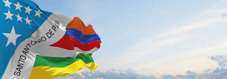 flag of Santo Antonio de Padua , Brazil at cloudy sky background on sunset, panoramic view. Brazilian travel and patriot concept. copy space for wide banner. 3d illustrationの写真素材