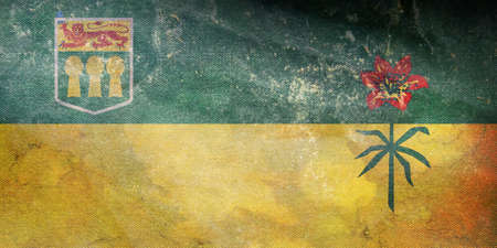 Top view of retro flag of Saskatchewan, Canada with grunge texture. Canadian patriot and travel concept. no flagpole. Plane design, layout. Flag backgroundの写真素材