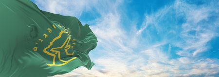 flag of Nature and Parks Authority , Israel at cloudy sky background on sunset, panoramic view. Israeli travel and patriot concept. copy space for wide banner. 3d illustrationの写真素材