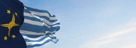 flag of Regionalista de Arica y Parinacota , Chile at cloudy sky background on sunset, panoramic...