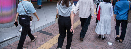 Japanese people walking and shopping in Tokyo, Japan. Shallow depth of field.の写真素材