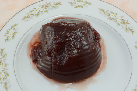 Canned cranberry sauce and juice on plate