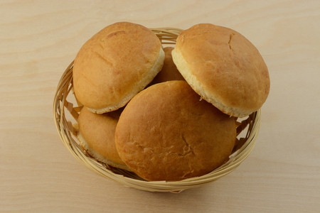 Wheat cocktail rolls in wood wicker bread basketの写真素材