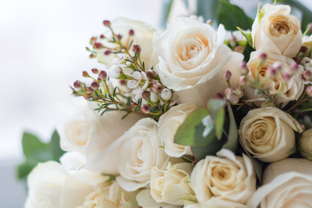 Tender beautiful wedding bouquet closeup, peach color roses and decoration, selective focusの写真素材