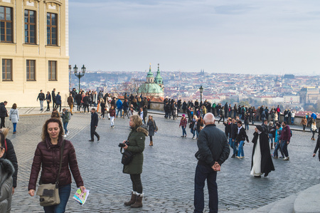 Prague, Bohemia / Czech Republic - November 2017: Tourists at the viewpoint near Prague Castle on a sunny autumn day, scenic view of the Mala Strana District (Lesser Town) and beyond, people walkingのeditorial素材