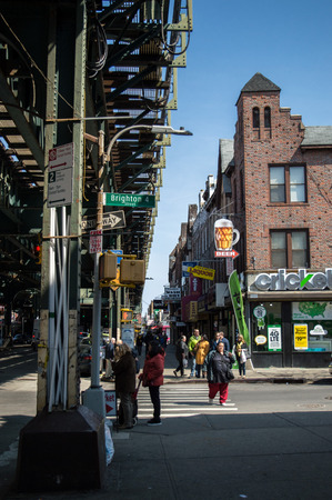 New York, NY  USA - April 2016: colourful  shops on the streets of Brighton Beach near the metal transport bridge.のeditorial素材