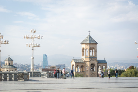 Tbilisi, Georgia - October 2018: people in the territory of the Holy Trinity Cathedral commonly...