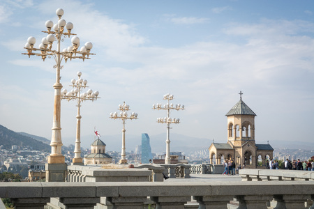 Tbilisi, Georgia - October 2018: people in the territory of the Holy Trinity Cathedral commonly...