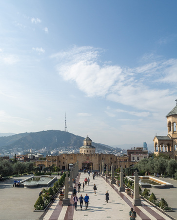 Tbilisi, Georgia - October 2018: people in the territory of the Holy Trinity Cathedral commonly...
