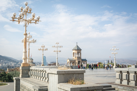 Tbilisi, Georgia - October 2018: people in the territory of the Holy Trinity Cathedral commonly...