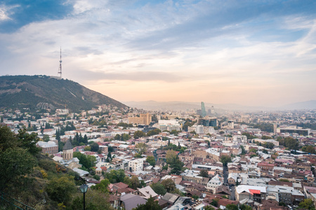 Tbilisi cityscape from a view point in the lights of sunset showing old and modern architecture, Georgiaの写真素材