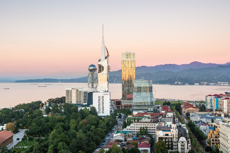 Batumi, Adjara, Georgia - October 2018: Panoramic view of Batumi sea resort from the Sheraton hotel at the sunset with skyscrapers and mountains in backgroundのeditorial素材