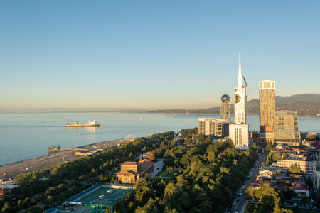 Batumi, Adjara, Georgia - October 2018: Panoramic view of Batumi sea resort from the Sheraton hotel at the sunset with skyscrapers and mountains in backgroundのeditorial素材