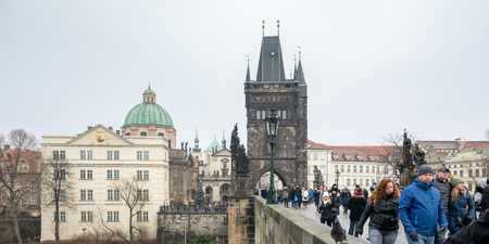 Prague, Czech Republic - December 2018: tourists walking on the Charles bridge.のeditorial素材