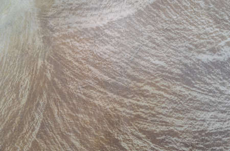 Stone texture abstract background. Detail of natural material gray and brown granite old rock wall...