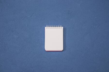 Notepad mockup, isolated blue background.の写真素材