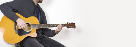 man playing acoustic guitar sitting on bar stool, musical instrument, isolated background.