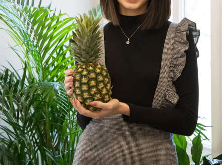 dietitian woman working with her computer and an office with mixed fruit and water on the table
