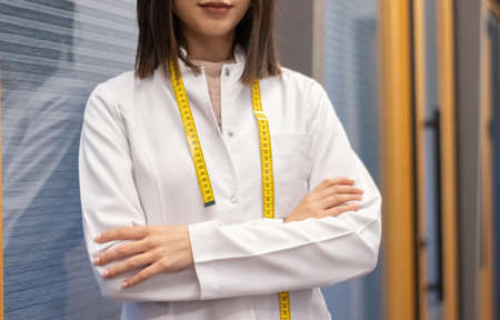 dietitian woman working with her computer and an office with mixed fruit and water on the tableの写真素材
