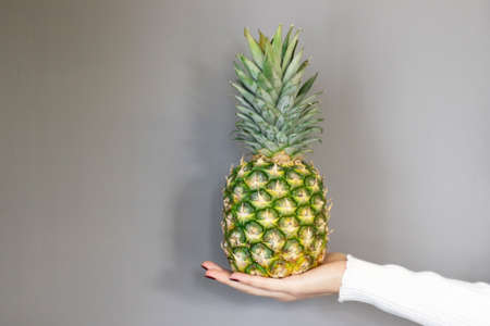 pineapple standing on the table, on isolated background