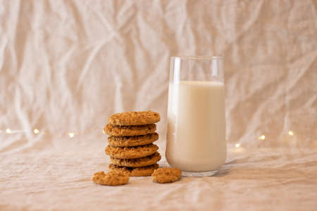 milk in glass standing on wooden standの写真素材