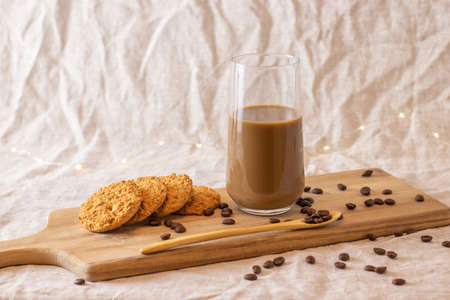 Mockup of female hand holding a coffee cup on office background