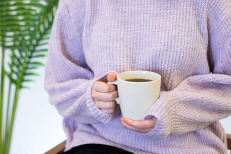 filter coffee in white mug, woman holding in handの写真素材