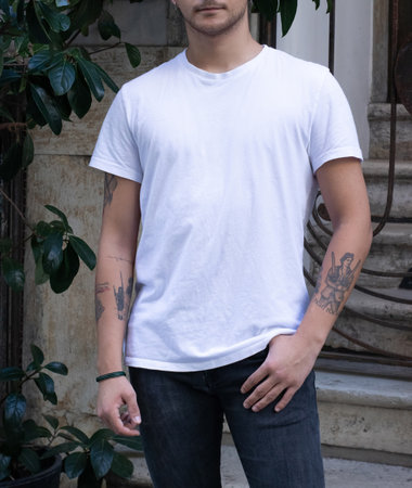 blank white t-shirt on young male on the street. fashion mockup