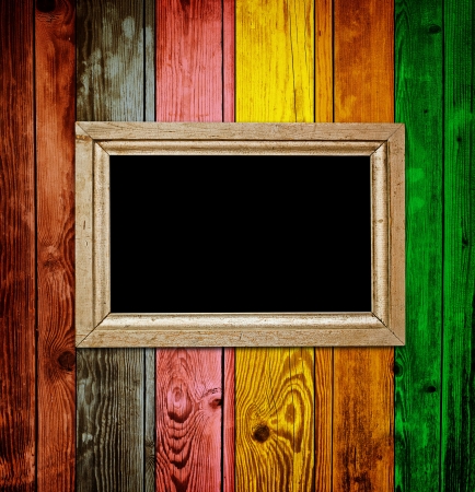 Empty frame on colorful wood backgroundの写真素材