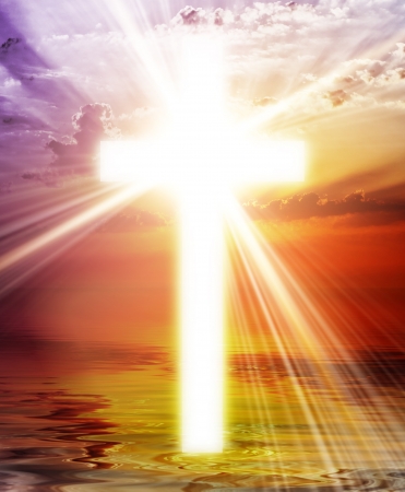 Cross appearing on sunrise skyの写真素材