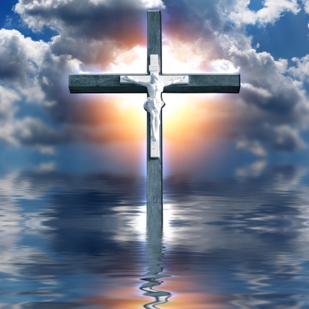 Cross Hangs in Sky over Waterの写真素材