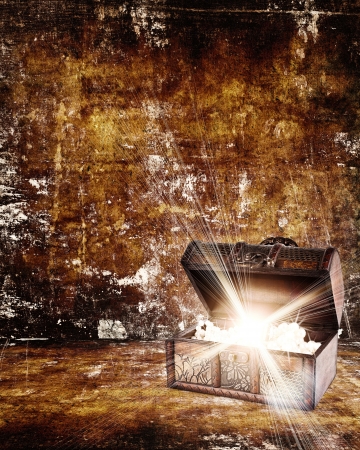 treasure chest with jewelry inside against grunge backgroundの写真素材