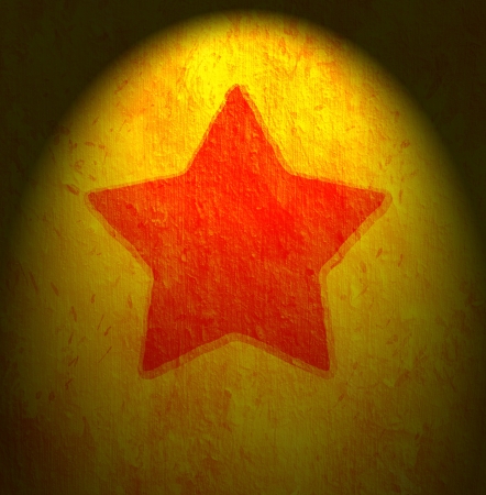 Grunge star on orange background の写真素材