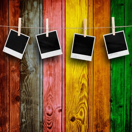 Blank Photos on Multicolored Wood Backgroundの写真素材