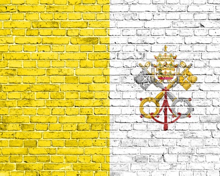 Grunge Vatican flag on brick wallの写真素材