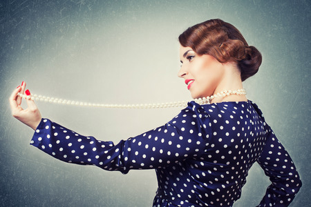 portrait of retro woman with pearlsの写真素材