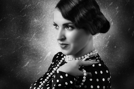 portrait of retro woman with pearlsの写真素材