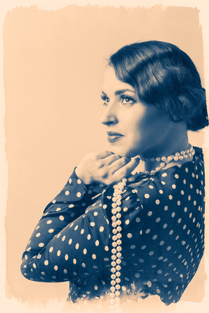 portrait of retro woman with pearlsの写真素材