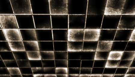 abstract background made from glowing grunge tilesの写真素材